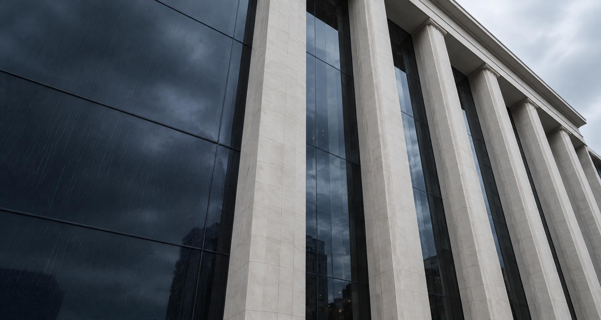 A contemporary courthouse with tall stone columns